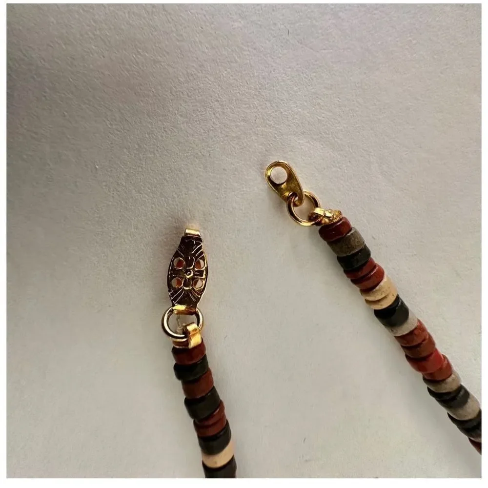 Brown black and gold tone beaded long necklace